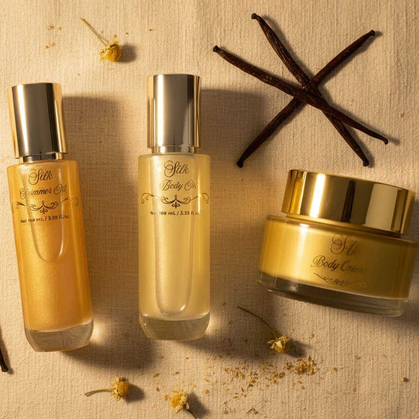 Skincare products with vanilla beans and flowers on a textured surface